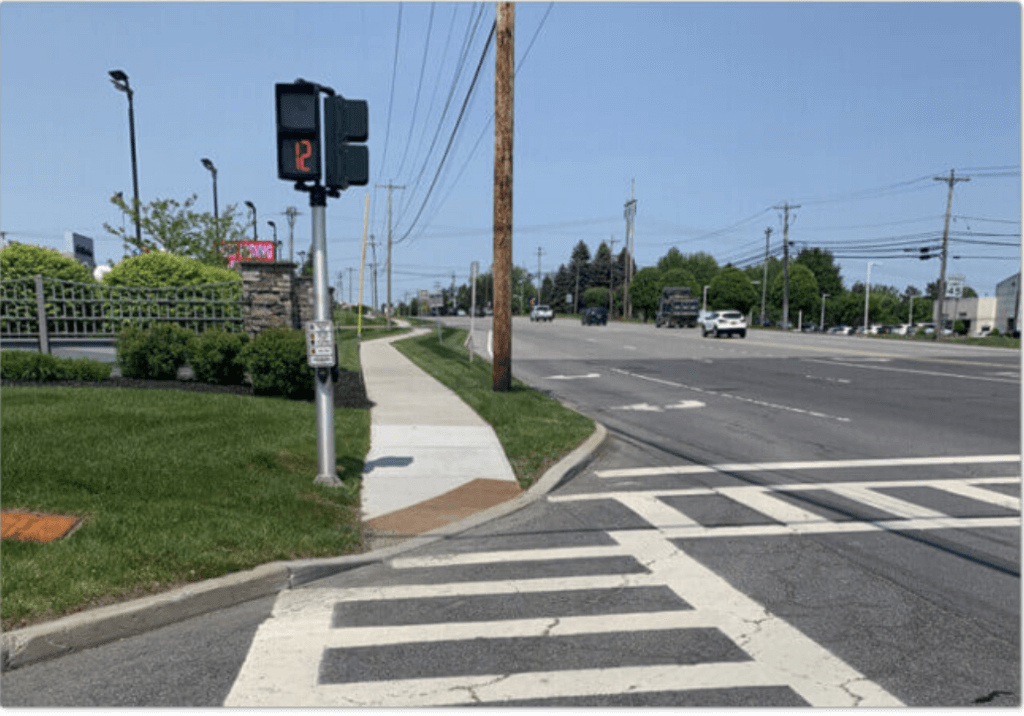 Walk sign and crosswalk