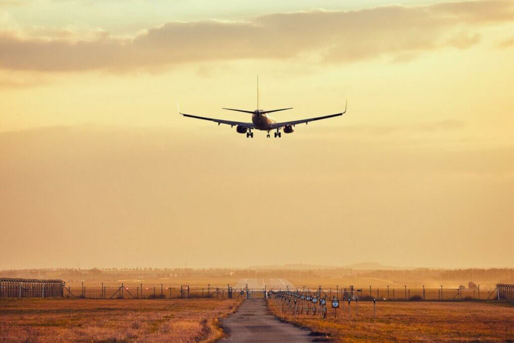 Airplane above the runway